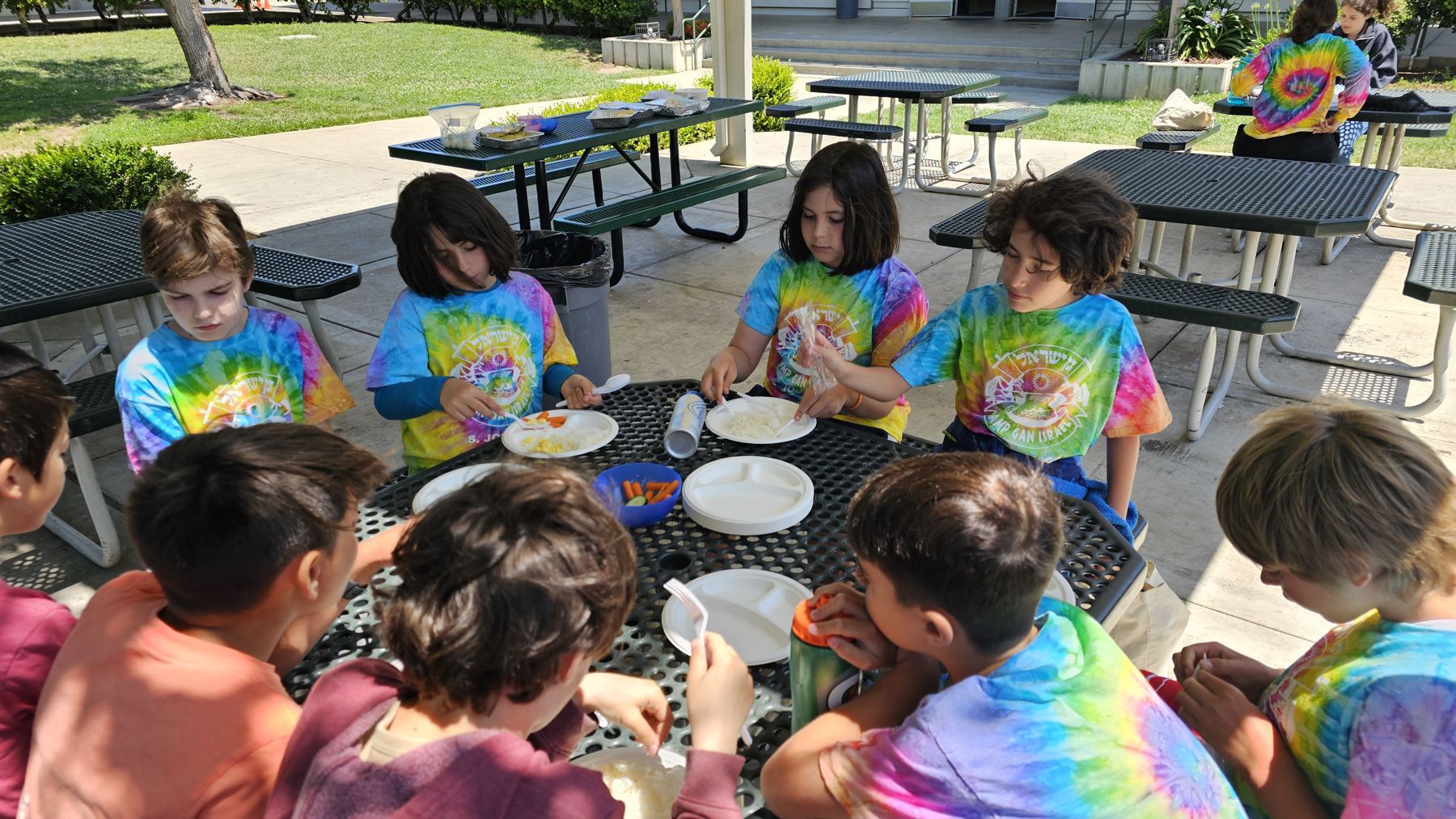 Children in tie dye at lunch