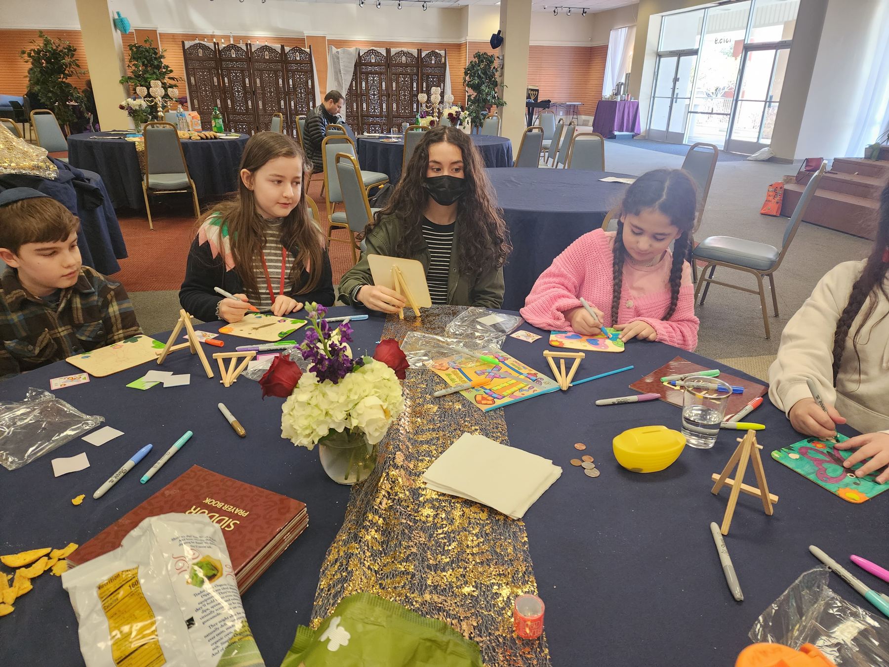 Kids making crafts at a holiday event