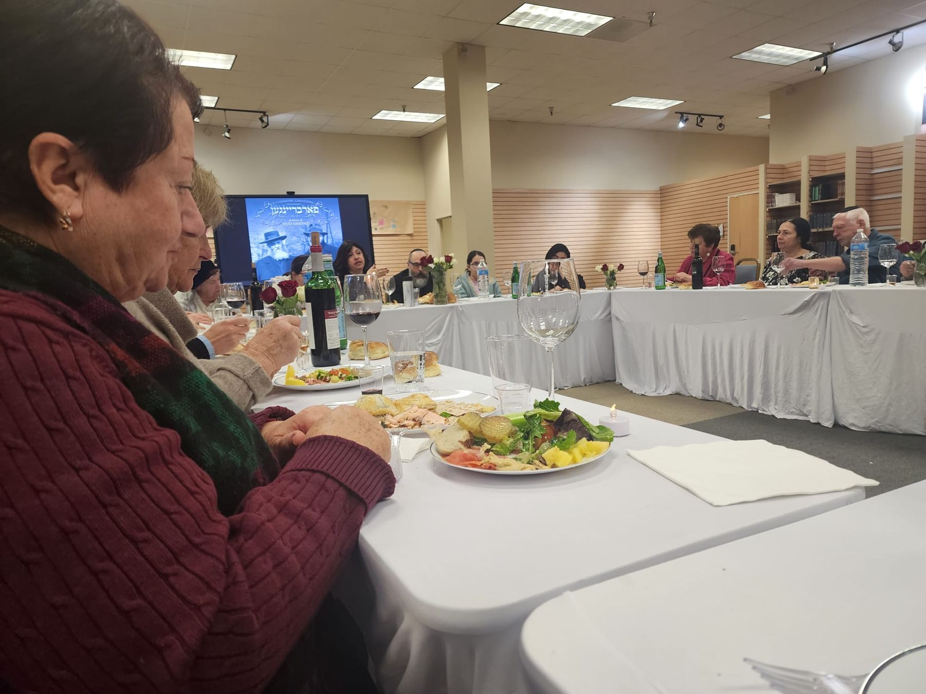 Friends at a community shabbat table