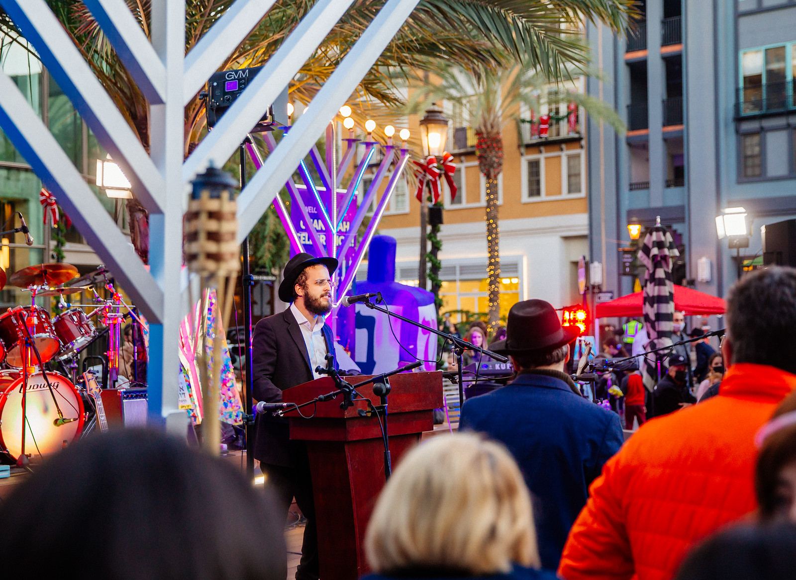 Rabbi speaking at the menorah lighting