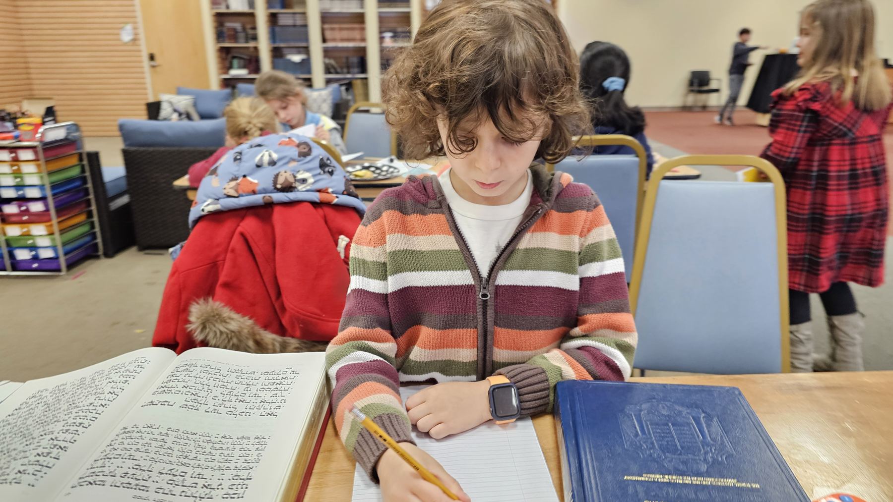 Girl writing in her notebook