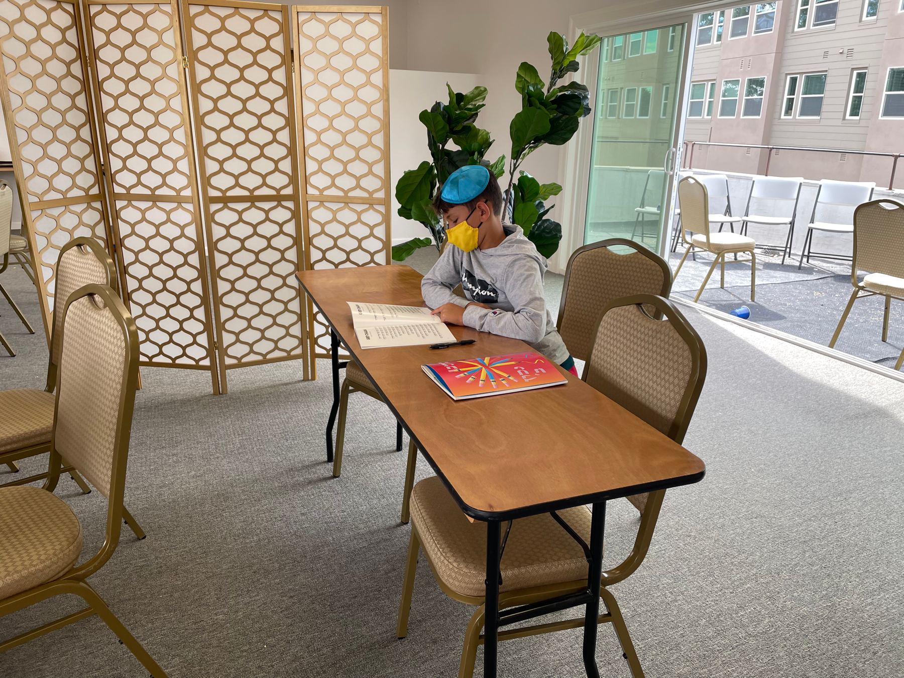 Student reading at a table